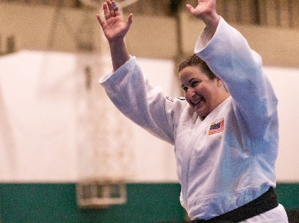 Nina Cutro-Kelly waves to the crowd after winning Gold in the Women's +78kg Judo at the 24th Summer Deaflympics